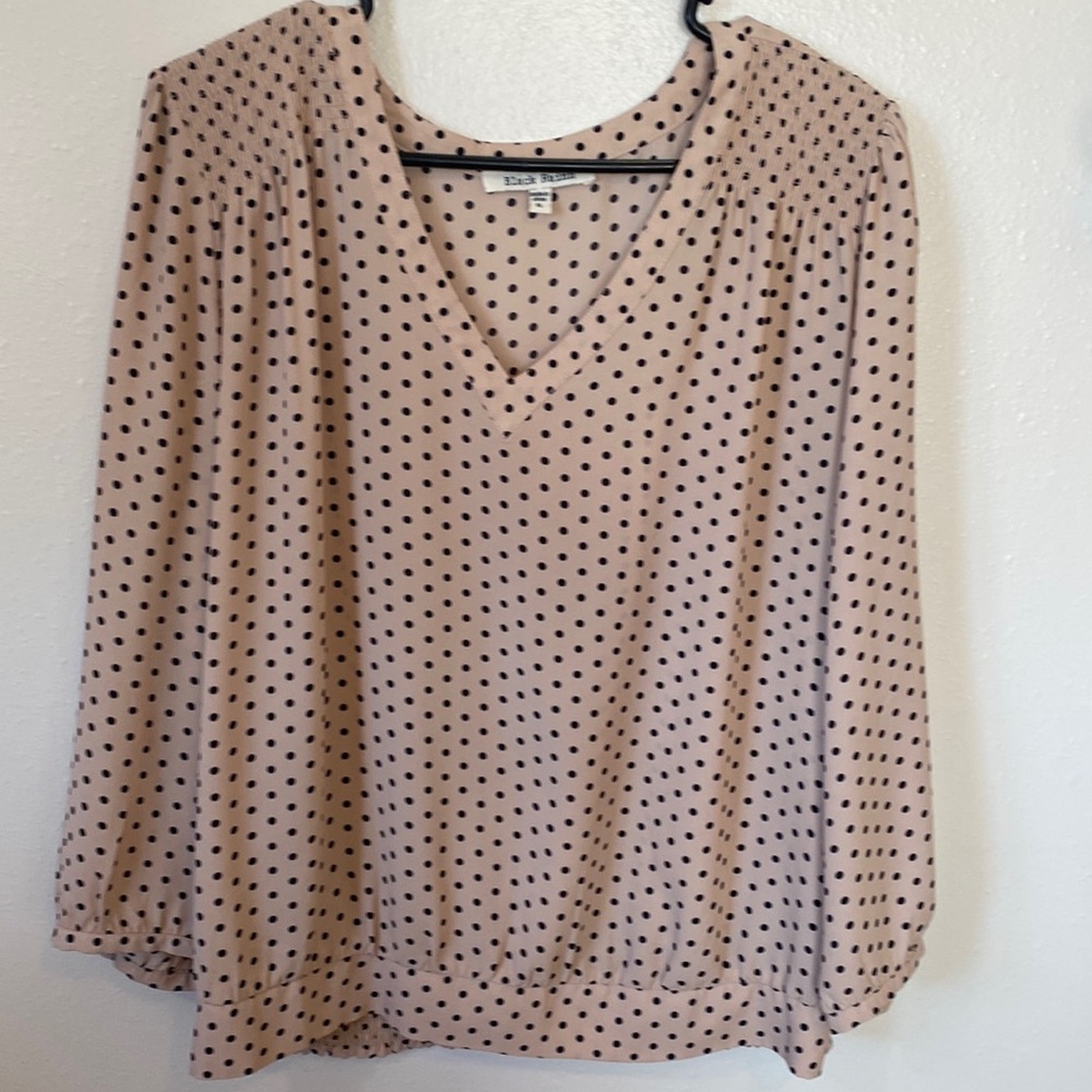 Pink and black polka dot top.